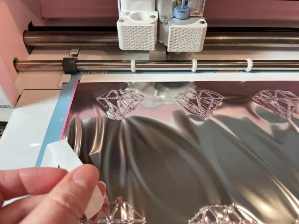 Gently remove the tape and foil from the cutting mat