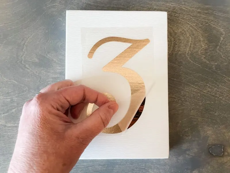 Attach adhesive foil to wood