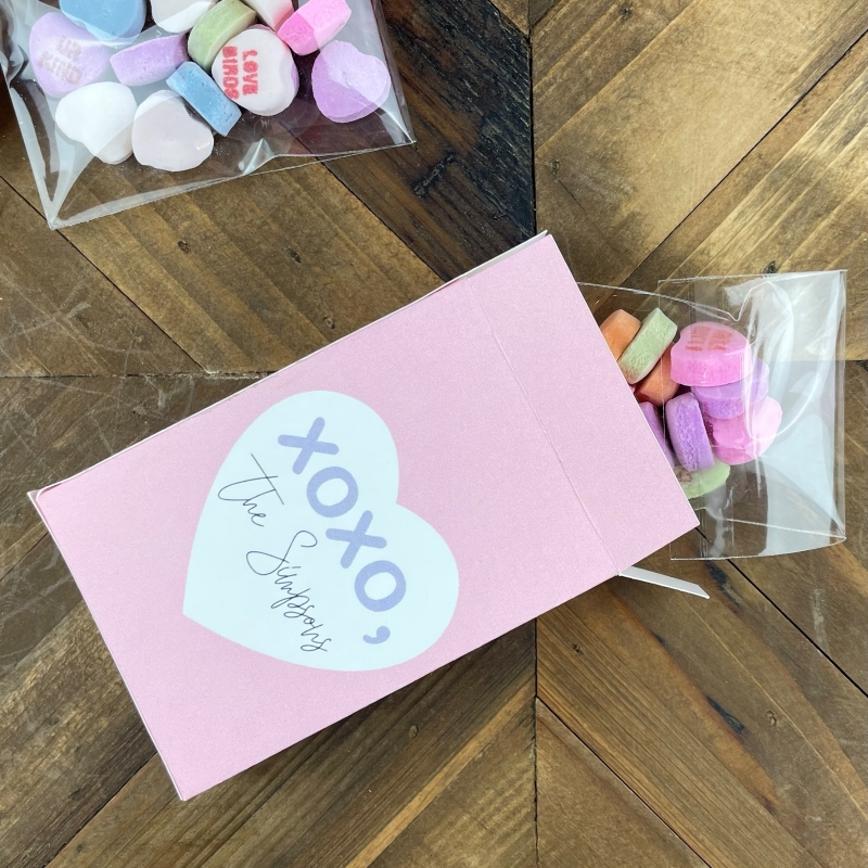 Place candy heart bags in box and seal closed