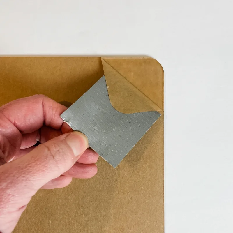 Remove paper backing from acrylic blank